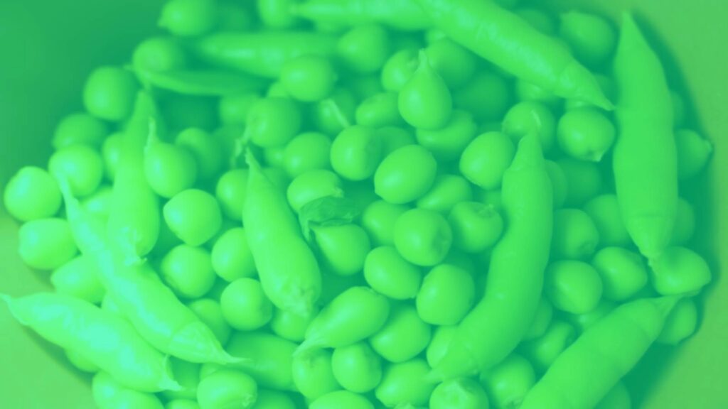 Fresh green edamame pods in a bowl, vibrant colors, soft lighting, realistic.