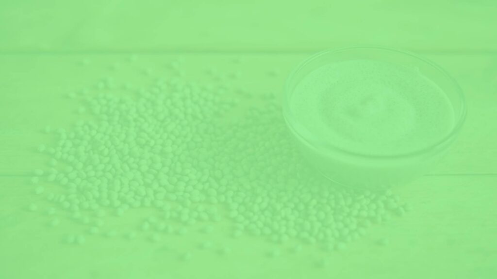 A handful of chia seeds scattered on a wooden table, with a small bowl of chia pudding next to them, soft natural lighting, realistic.
