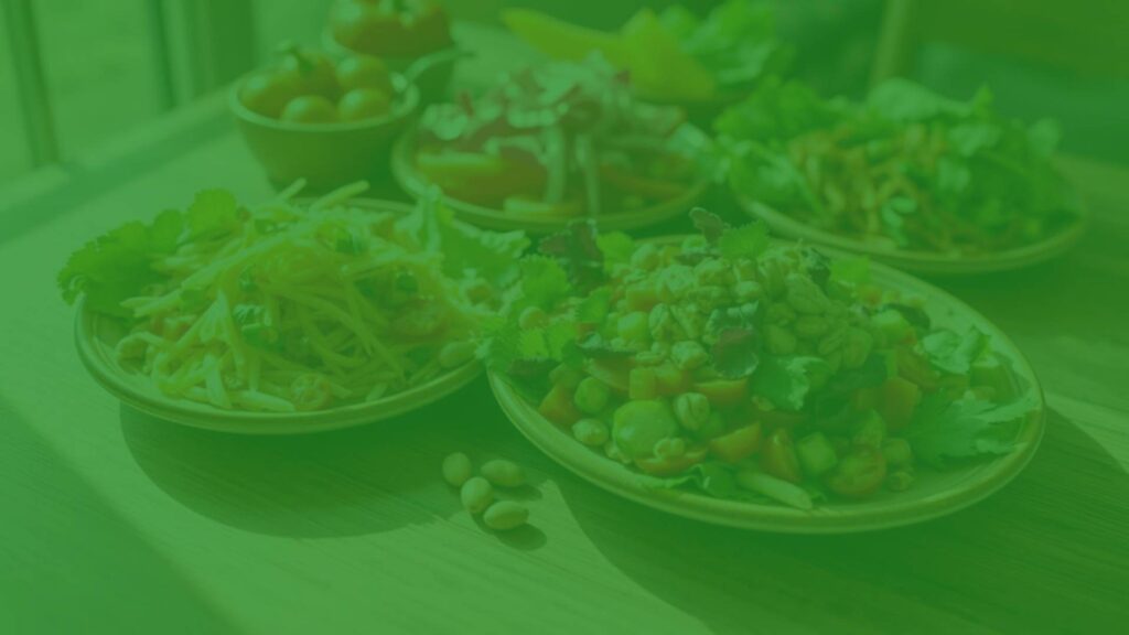 Fresh vegetarian meals rich in selenium, colorful vegetables and nuts on a wooden table, natural lighting, healthy and vibrant.