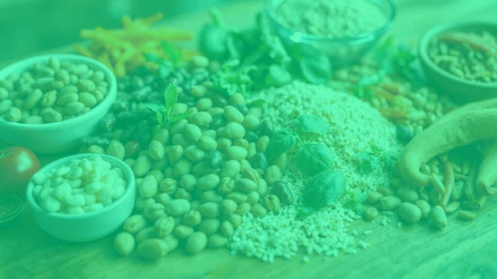 A vibrant array of plant-based foods rich in vitamin B3, including nuts, legumes, and whole grains, artfully arranged on a wooden table, natural lighting, soft focus.