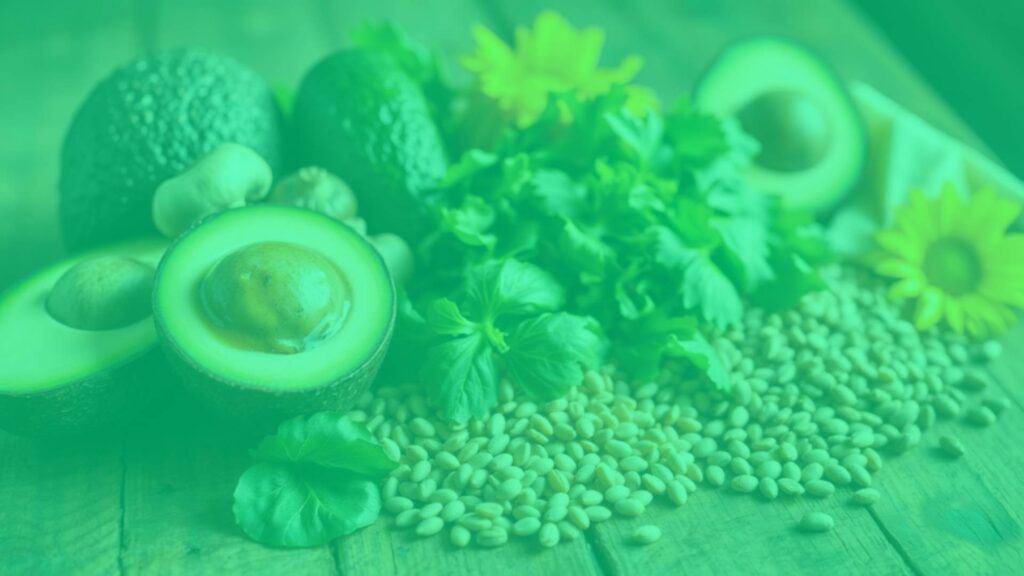 A colorful assortment of vegetarian foods rich in Vitamin B5, including avocado, mushrooms, lentils, and sunflower seeds, arranged on a wooden table with soft natural lighting, health and wellness theme, realistic.