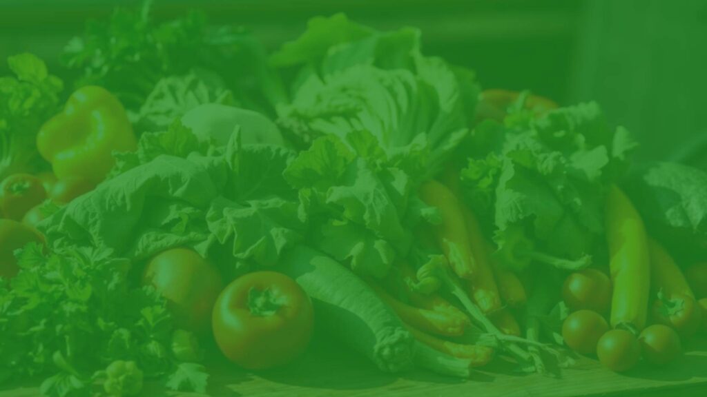 Fresh leafy greens and colorful vegetables rich in folate, arranged neatly on a wooden table, natural sunlight, realistic.