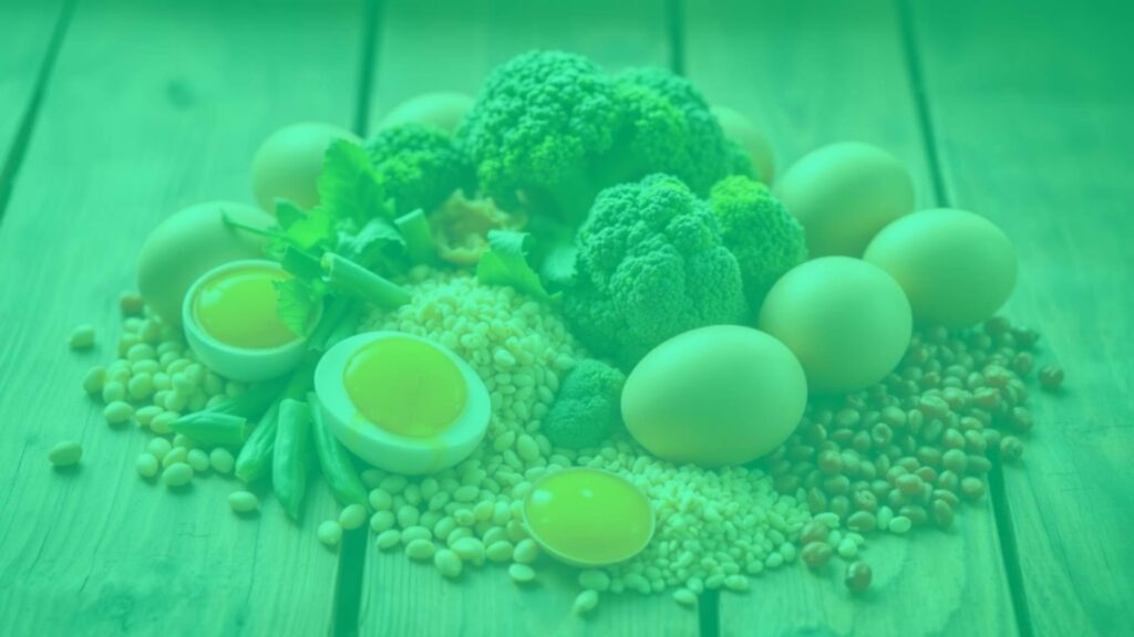 A colorful assortment of vegetarian choline-rich foods like eggs, soybeans, quinoa, and broccoli, arranged beautifully on a wooden table, bright and natural lighting, realistic style.
