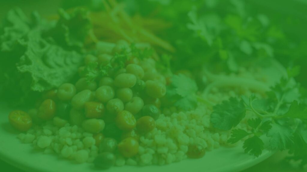 A healthy vegetarian meal rich in silicon, featuring leafy greens, legumes, and whole grains, glowing with natural light, realistic.