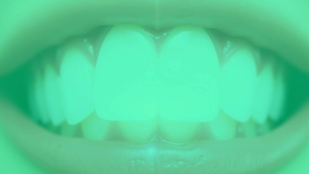 Healthy white teeth with glowing enamel, fluoride droplet, dental care concept, clean and bright, simple and modern.